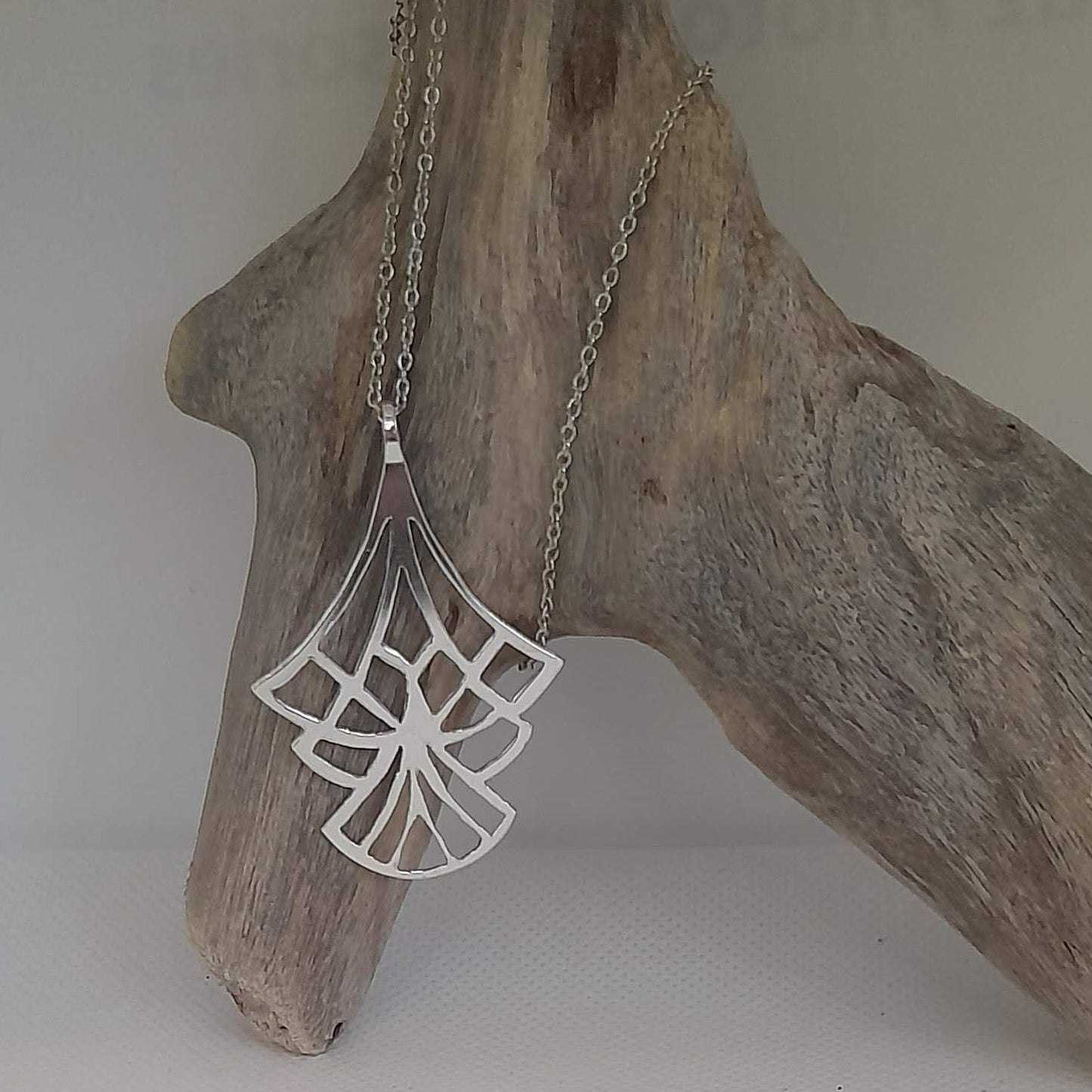 art deco inspired saw pierced pendant
