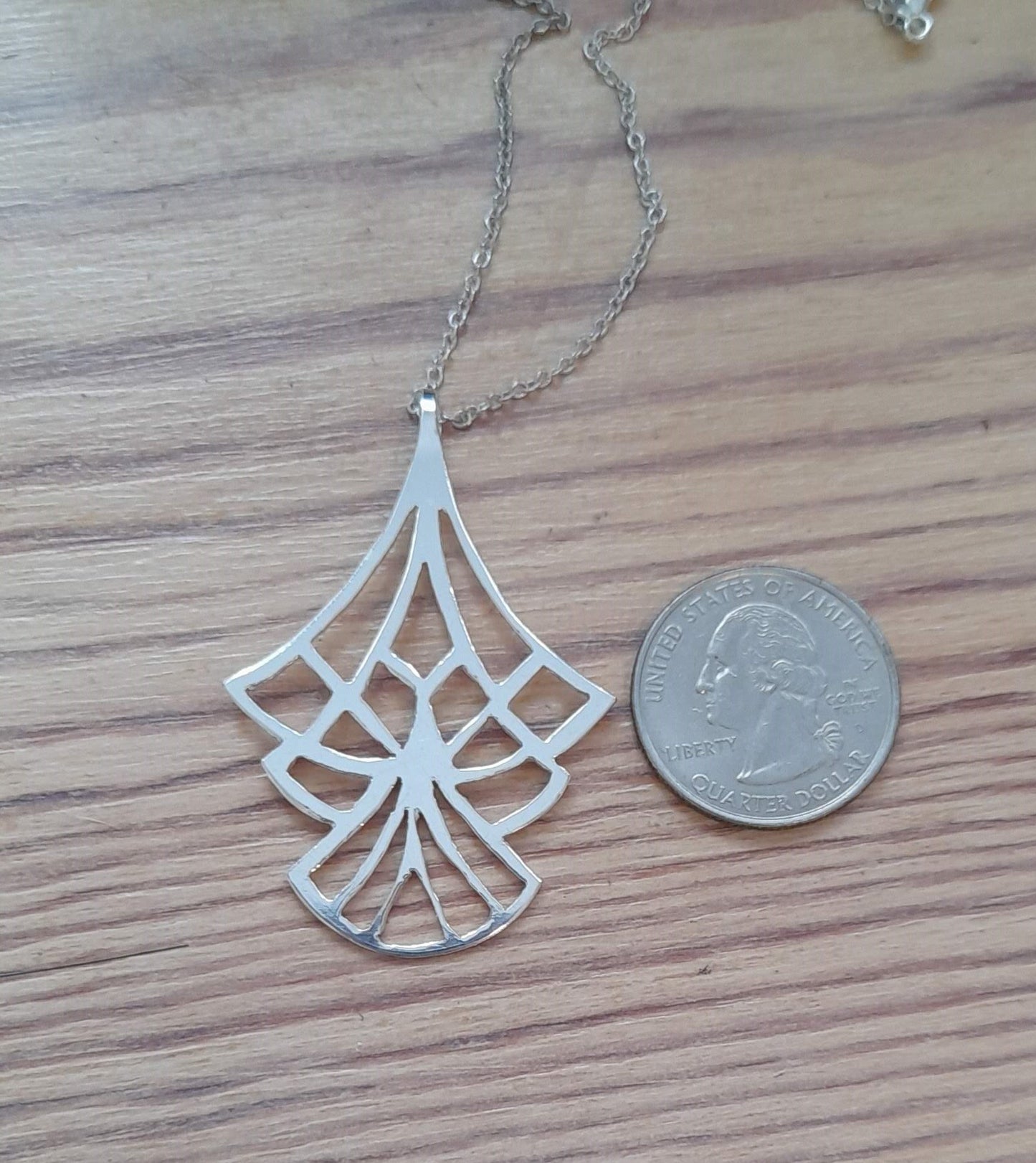 art deco inspired saw pierced pendant